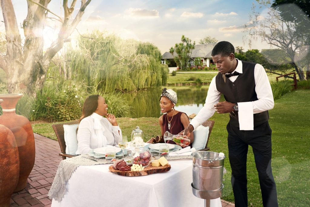 Waiter serves customers